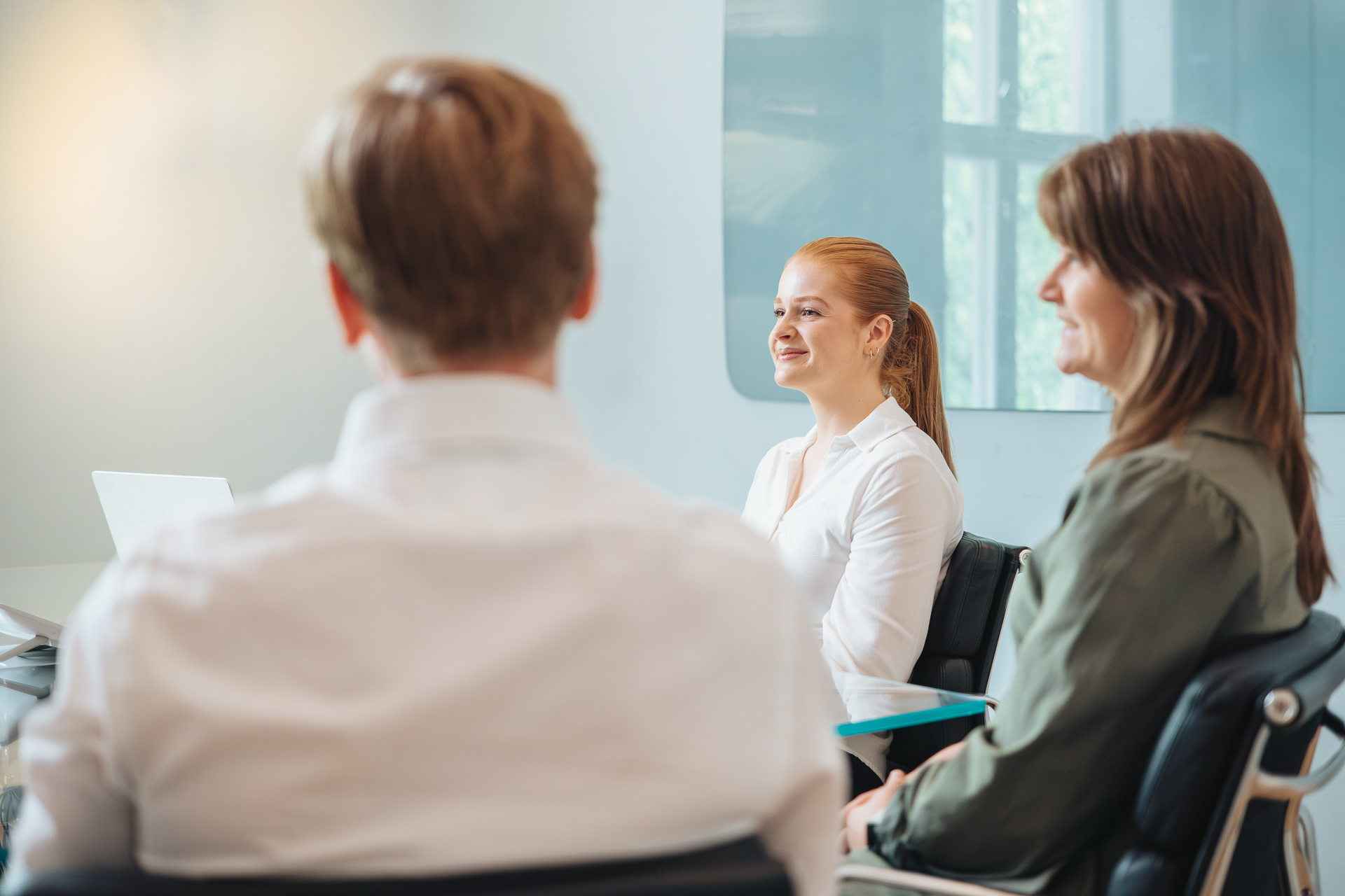 Smiling man in a meeting